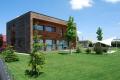 casa moderna con facciate in legno naturale  | RIKO-HISE srl - Arch. Daniele Bonzi